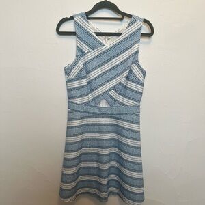 Blue and white cocktail dress with cutouts